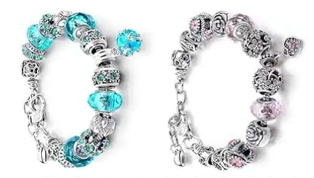 A silver bracelet with blue and pink beads.