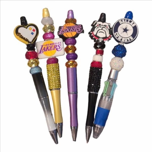 A group of pens with different designs on them.